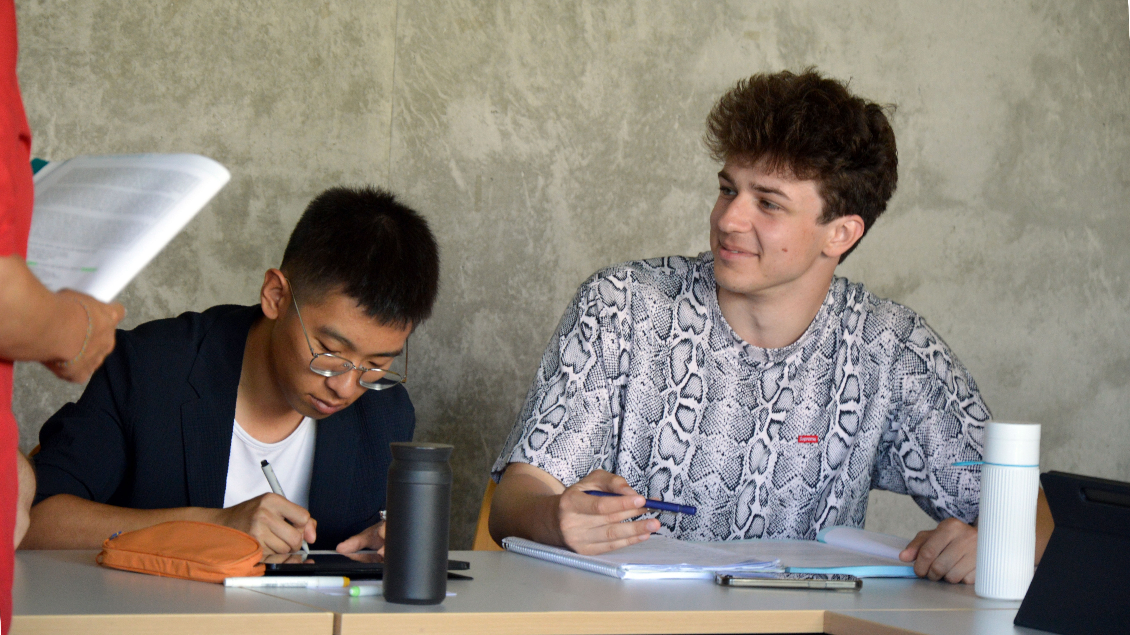 Students are sitting in a classroom.